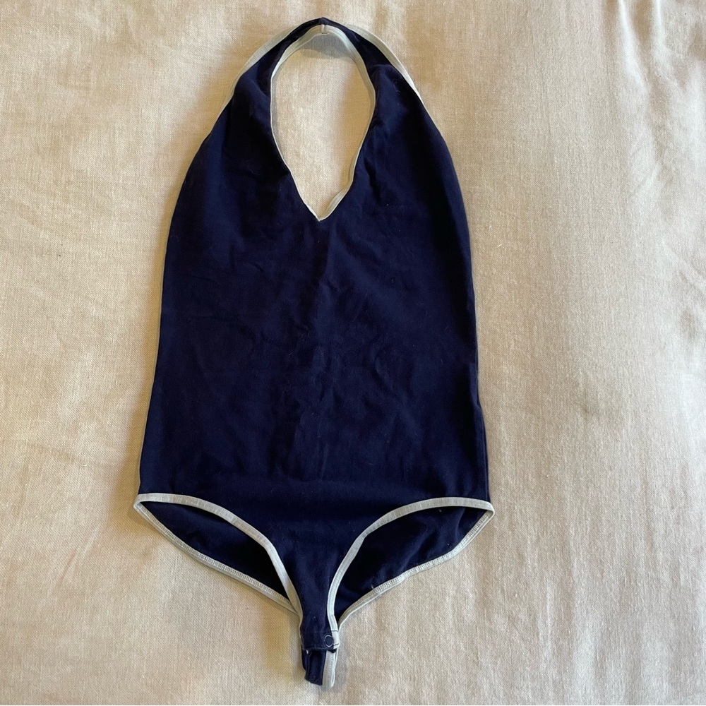 Blue halter bodysuit with white lining